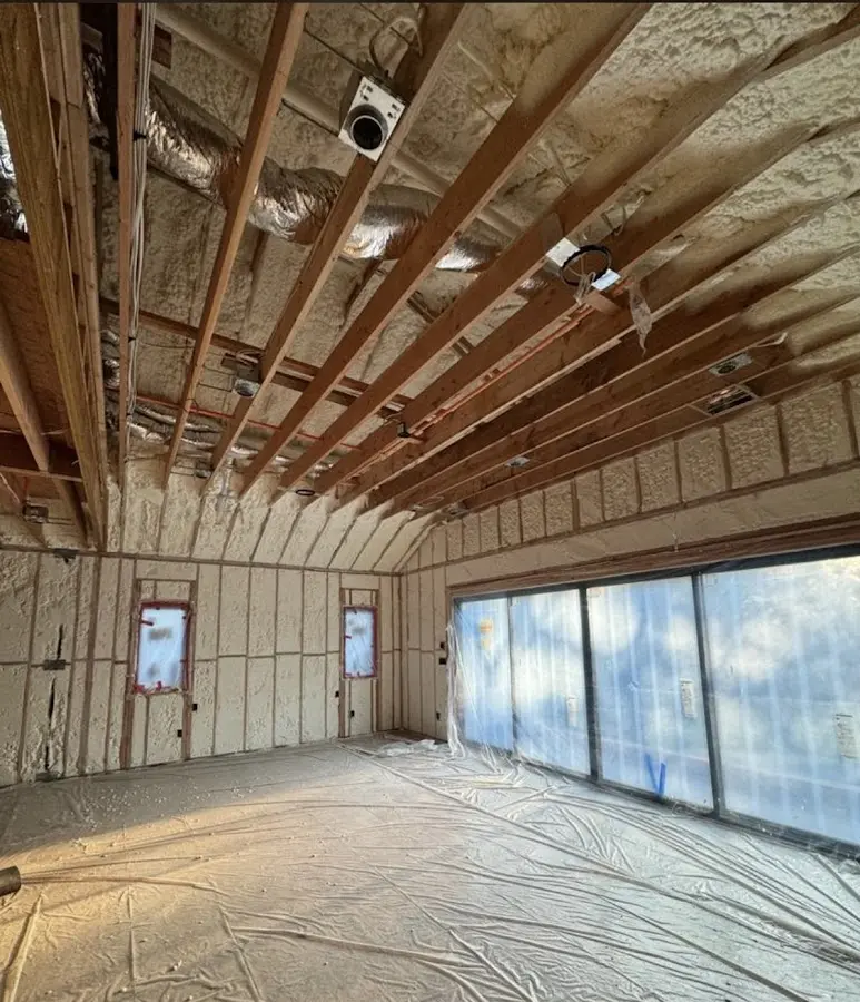 Interior walls and ceiling insulated with spray foam during new construction in Fair Haven